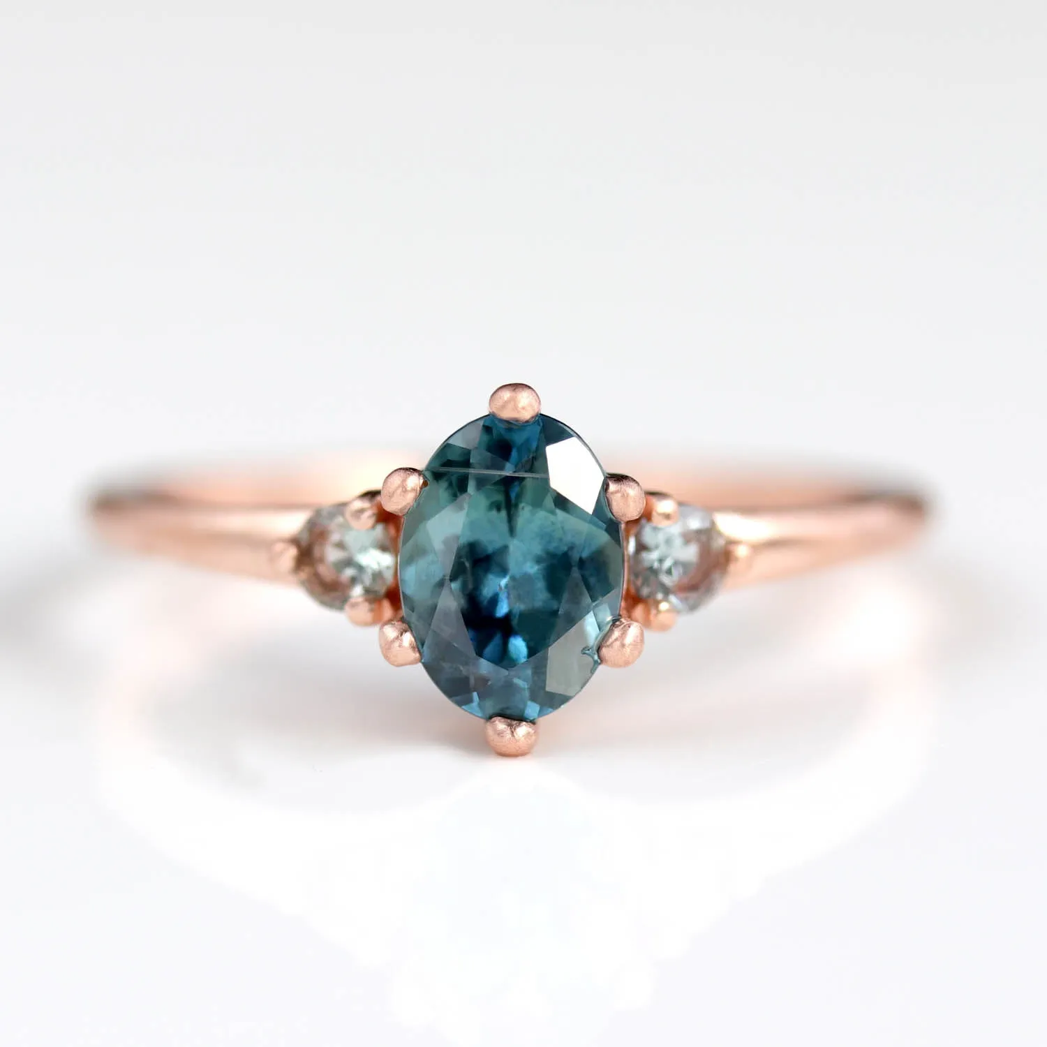 7x5mm Oval Six-Prong Three Stone Ring with Teal Malawi Sapphires