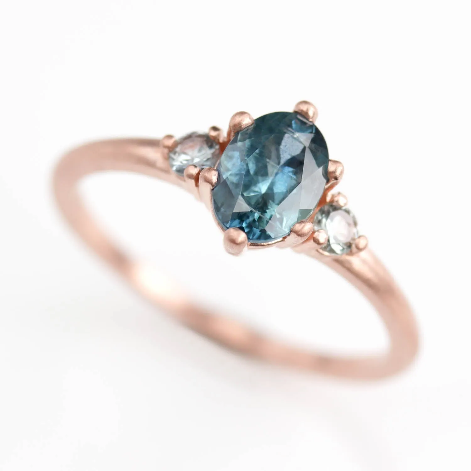 7x5mm Oval Six-Prong Three Stone Ring with Teal Malawi Sapphires