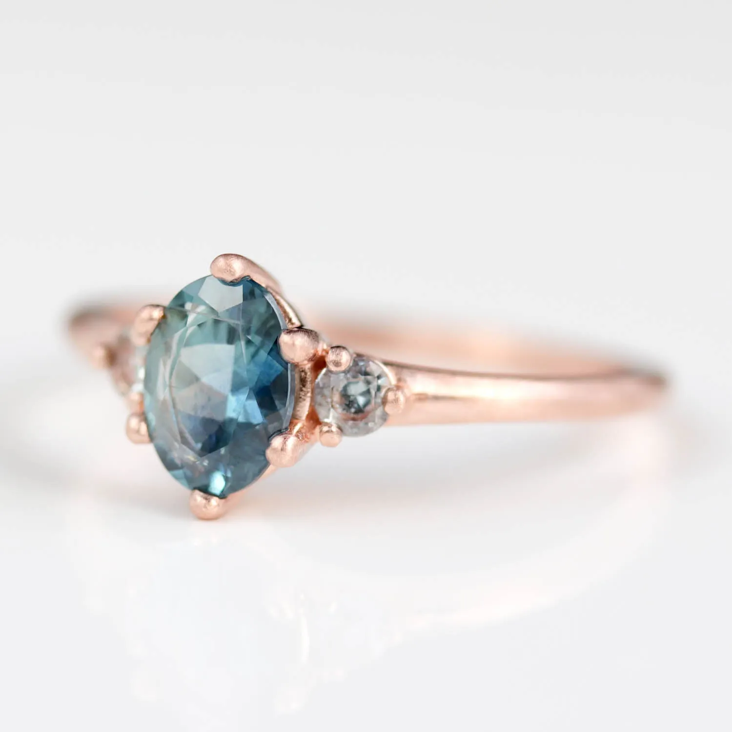 7x5mm Oval Six-Prong Three Stone Ring with Teal Malawi Sapphires